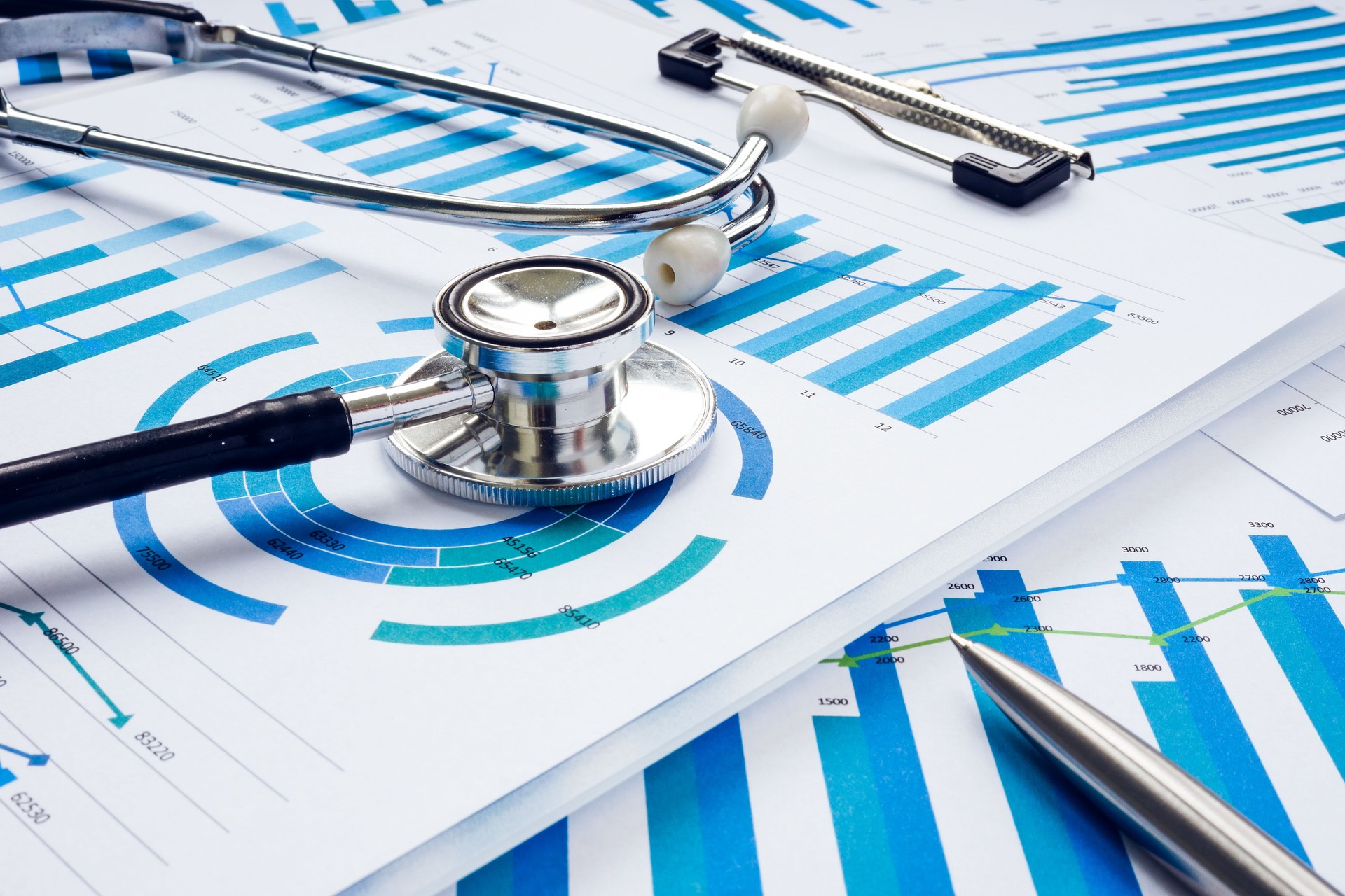 Business audit and analysis concept. Stethoscope on the financial charts.