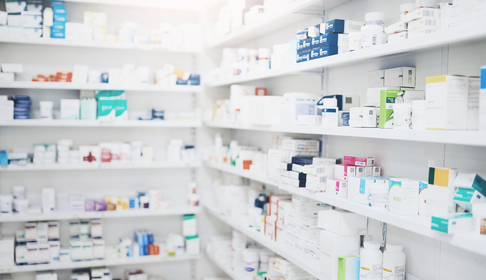 Pharmacy, medicine and box with healthcare shop, shelf and prescription care pills. Medical, retail store and supply of health supplements, vitamins and minerals for vitality and wellness dispensary