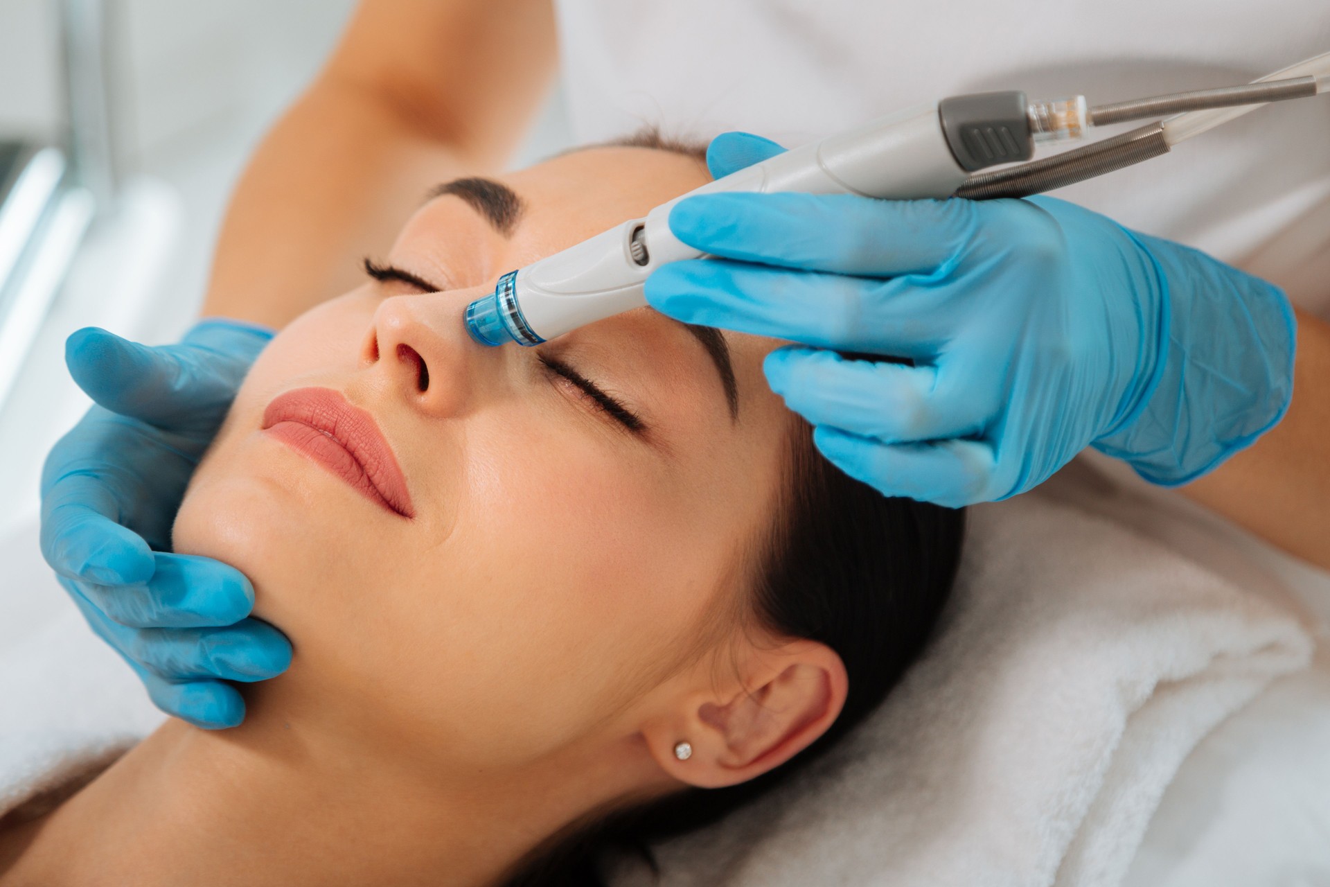 Delighted nice positive woman having Hydradermabrasian procedure